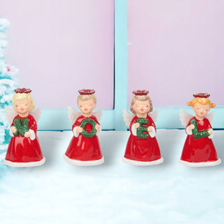 Four angel figurines in red dresses holding green numbers on a white background